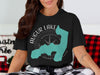 Black t-shirt with Augur Lake and compass design, New York state map overlay.