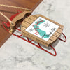 Wooden sled ornament with "Merry Christmas" and "From Grand Lake" text.