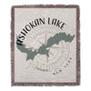 Ashokan Lake, New York map with compass on a fringed woven blanket.