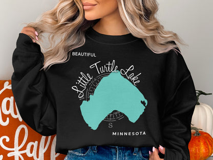Black sweatshirt with "Beautiful Little Turtle Lake" and Minnesota map graphic.