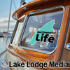 Turquoise outline sticker with "Rattlesnake Life" text on boat window.