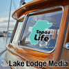 Turquoise map sticker on boat window reads "Topaz Life" with "Lake Lodge Media" logo.
