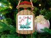 Sled ornament with "Merry Christmas From Hayden Lake" text on a Christmas tree.