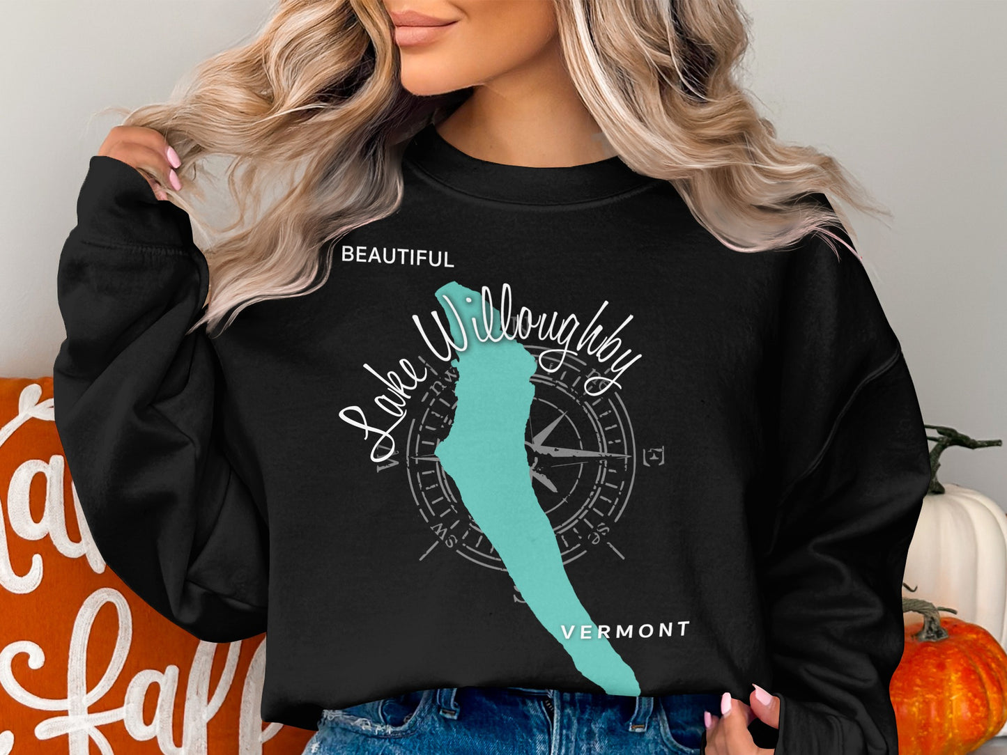 Black sweatshirt with "Beautiful Lake Willoughby Vermont" and compass rose graphic.