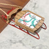 Wooden sled ornament with "Merry Christmas From Kaukau Lake" text.