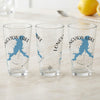 Three clear glasses with blue Longview Lake map and compass designs.