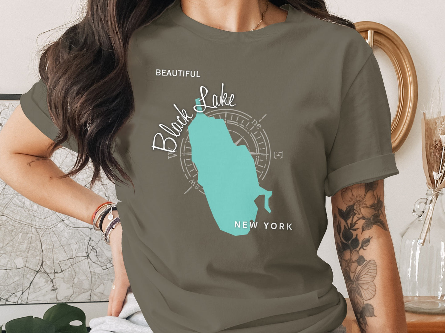 T-shirt with teal Black Lake map and compass rose graphic.