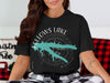 Black t-shirt with Fellows Lake Missouri compass graphic and teal lake outline.
