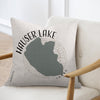 Pillow with "Hauser Lake Idaho" text and lake silhouette on a chair.