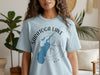 Light blue t-shirt with Saratoga Lake map and compass graphic, 
New York text.