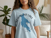 Light blue t-shirt with a blue map outline of Newfound Lake and compass design.