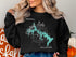 Black sweatshirt with "Beautiful Shatook Lake Oklahoma" and compass graphic.