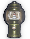 Lantern-shaped pillow with a snowman inside a snow globe.