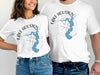 White t-shirts featuring blue Lake Houston map overlaying a compass rose graphic.