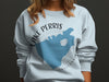 Light blue sweatshirt with Lake Perris California graphic and compass design.