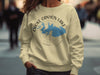 Light yellow sweatshirt with Choke Canyon Lake Texas map and compass graphic.