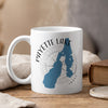 White mug with Payette Lake map graphic and compass rose, steam rising.
