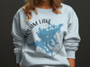 Light blue sweatshirt featuring a blue map of Squam Lake with "Squam Lake" and "New Hampshire" text.