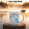 White mug with "Lake Livingston Texas" and compass design on lakeside background.