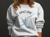 White sweatshirt with "Lake Sinclair Georgia" graphic and compass rose design.