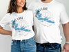 White t-shirts with "Rainy Lake Minnesota" and compass design.