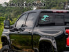 Black truck with "Lake Lodge Media" and "Silverwood Life" decals on the window.