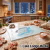 A glass cutting board featuring a blue map of Lake Jackson, Georgia, surrounded by holiday baking supplies on a kitchen counter.