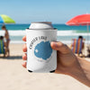 White can cooler with Crater Lake Oregon map graphic held on a beach.