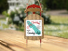Sled-shaped ornament with "Merry Christmas From Onondaga Lake" text and snowflakes.