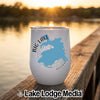 A white stemless tumbler with a blue map of Big Lake, Arizona, rests on a wooden dock.