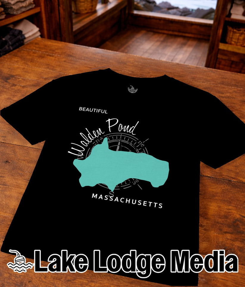 Black t-shirt with a teal outline map of Walden Pond and "Lake Lodge Media" text.