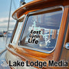Decal reading "East Lynn Life" on a boat window, with "Lake Lodge Media" logo at the bottom.