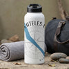 White water bottle with black lid, "Skaneateles Lake" text, compass graphic, and blue stripe.