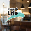Kiawah Life text overlaying a teal outline of a peninsula with a white border.