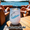 A white insulated wine tumbler featuring a blue outline of Lake Erie sits on a boat table.