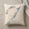 Pillow with Key Largo Florida map, compass, and text on a textured background.