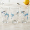 Three clear glasses display a blue Kerr Lake map and compass graphic.