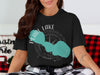 Black t-shirt with a Pearl Lake, Wisconsin graphic featuring a compass rose outline.