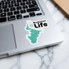 Buchanan Life sticker with teal lake outline on laptop keyboard