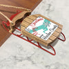 Wooden sleigh ornament with "Merry Christmas From Harlan County" text.