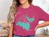 Pink t-shirt with Brooks and Hess Lake map and compass design.