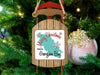Sled ornament with "Merry Christmas from Georgian Bay" text on a decorated Christmas tree.
