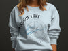 Light blue sweatshirt with Norris Lake Tennessee compass graphic and water silhouette.