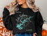 Black sweatshirt with Wedowee map graphic and compass rose.