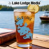 Glass with iced tea, lemon slice, Lobster Lake map design, and Lake Lodge Media logo.