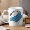 White mug with blue Lake Quinault map and compass design, "Lake Quinault Washington" text.