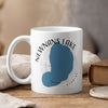 White mug with Newnans Lake map, compass rose, and "FLORIDA" text.
