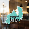 Turquoise map sticker with "Mendenhall Life" text on a window.