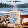 White mug with Lake Buchanan map and compass design on a rainy window background.