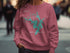 Mermaid Lake North Carolina graphic on a pink sweatshirt.